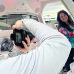 Influencer filming on a boat